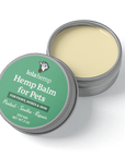 This image shows Lolahemp balm tin open with the cap visible.